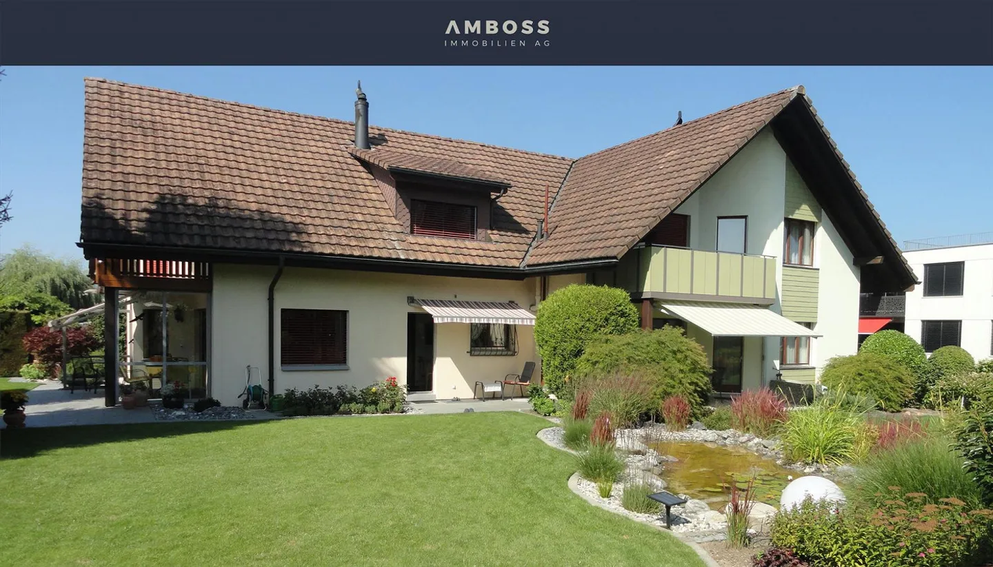 Casa unifamiliare ben tenuta con giardino da sogno in una tranquilla strada senza uscita - Foto 1 di 13