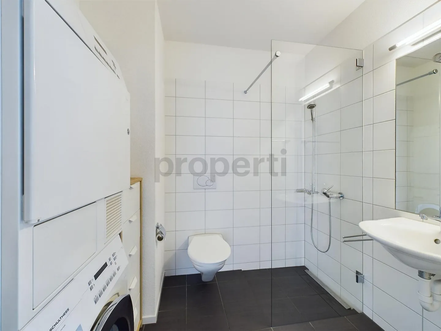 Covered terrace and Minergie comfort, own washing tower and parking... - Photo 16 of 17