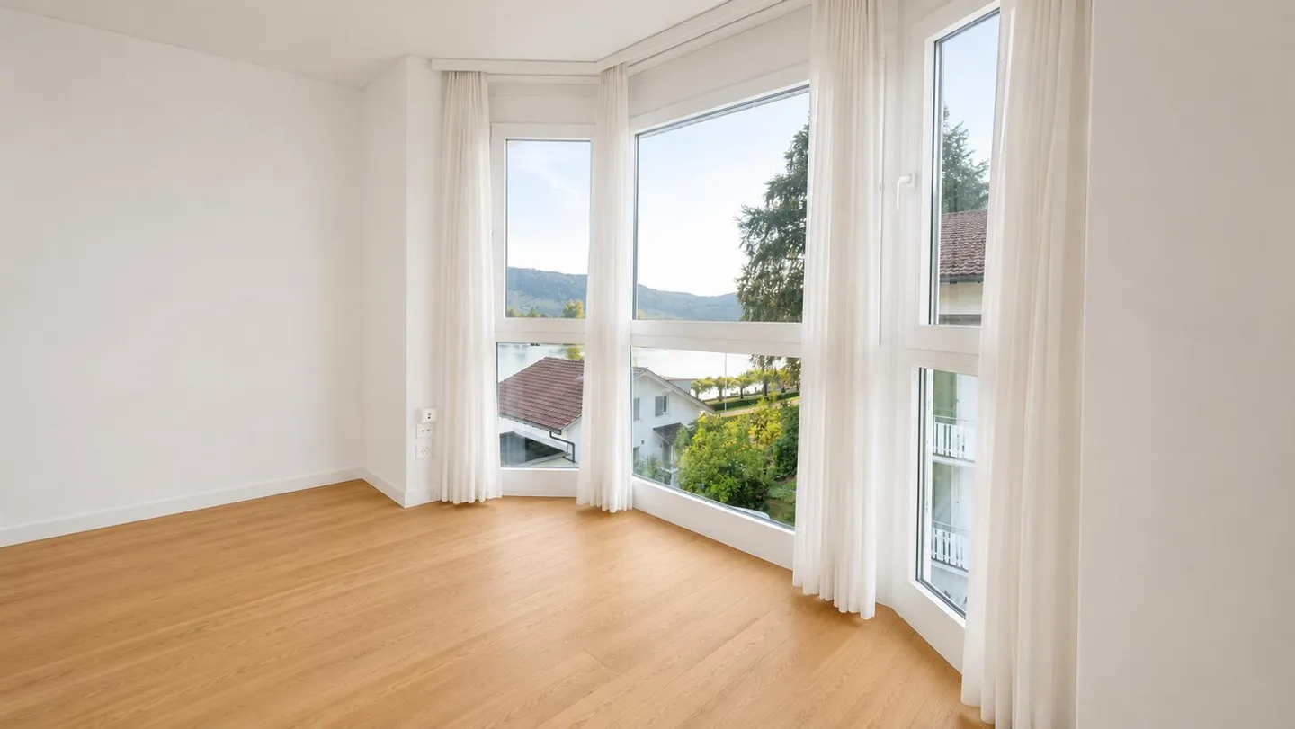 Charmante Wohnung mit Seesicht - Foto 3 von 6