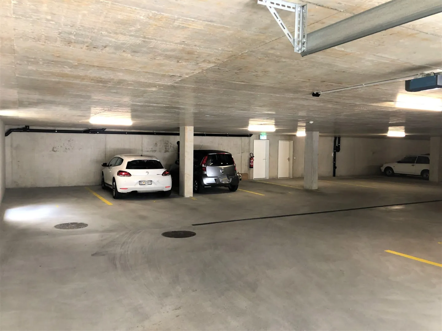 Parking space for rent in modern, closed parking garage - Photo 2 of 5