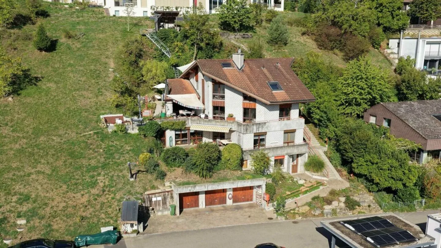 Two-family house with office in the best residential area of Liestal - Photo 1 of 20