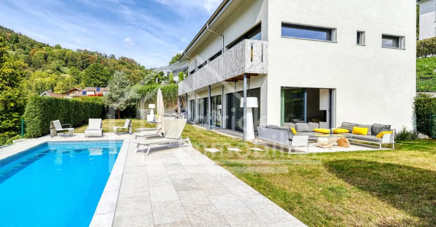 Exceptional contemporary property with panoramic lake view - Photo 1 of 13