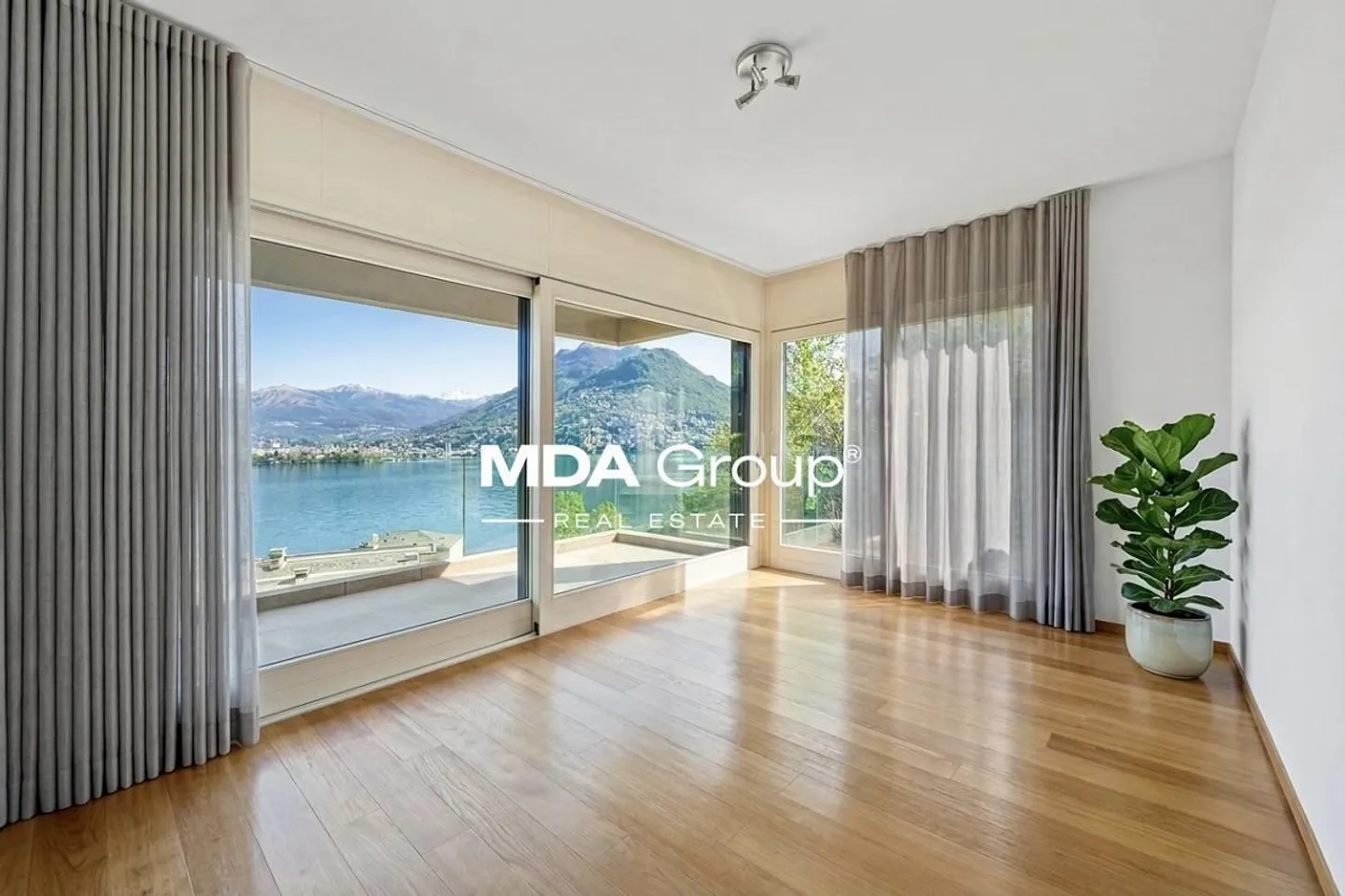 Design-Appartement mit Seeblick - Foto 1 von 13