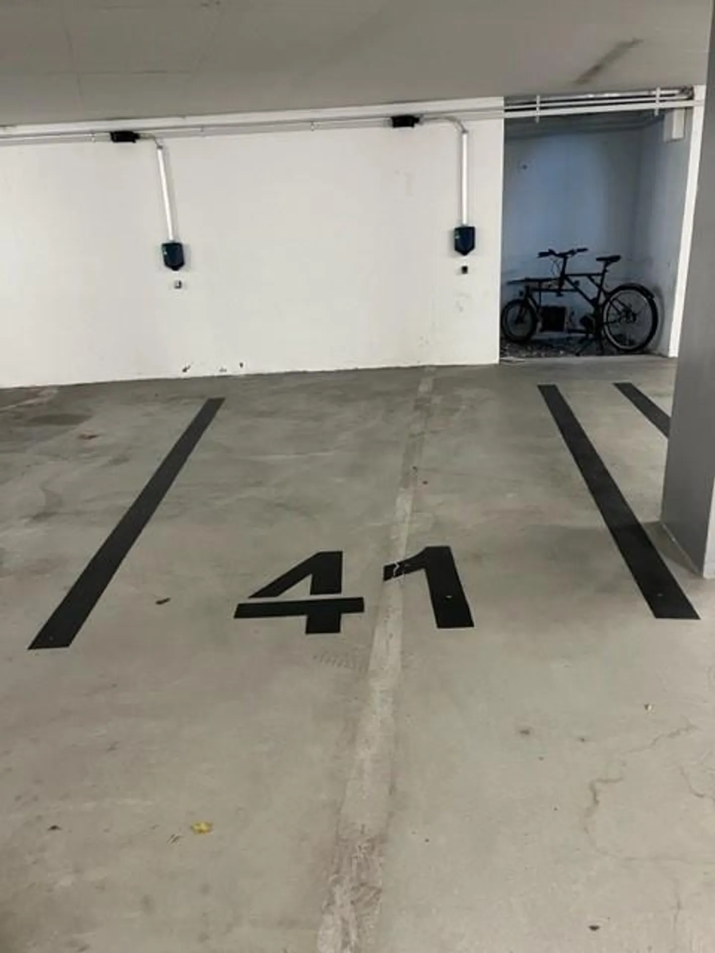 Parking space with electric charging station - Photo 3 of 3