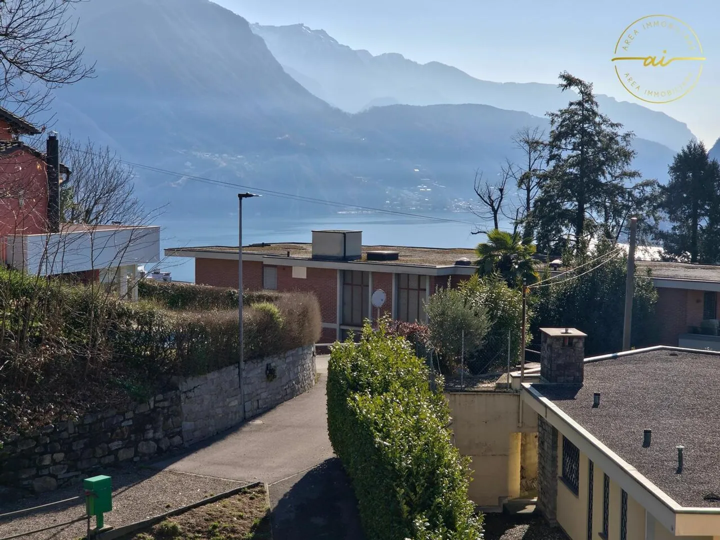 APPARTEMENT 4.5 PIÈCES AVEC TERRASSE ET VUE SUR LE LAC À MASSAGNO - Photo 1 sur 13