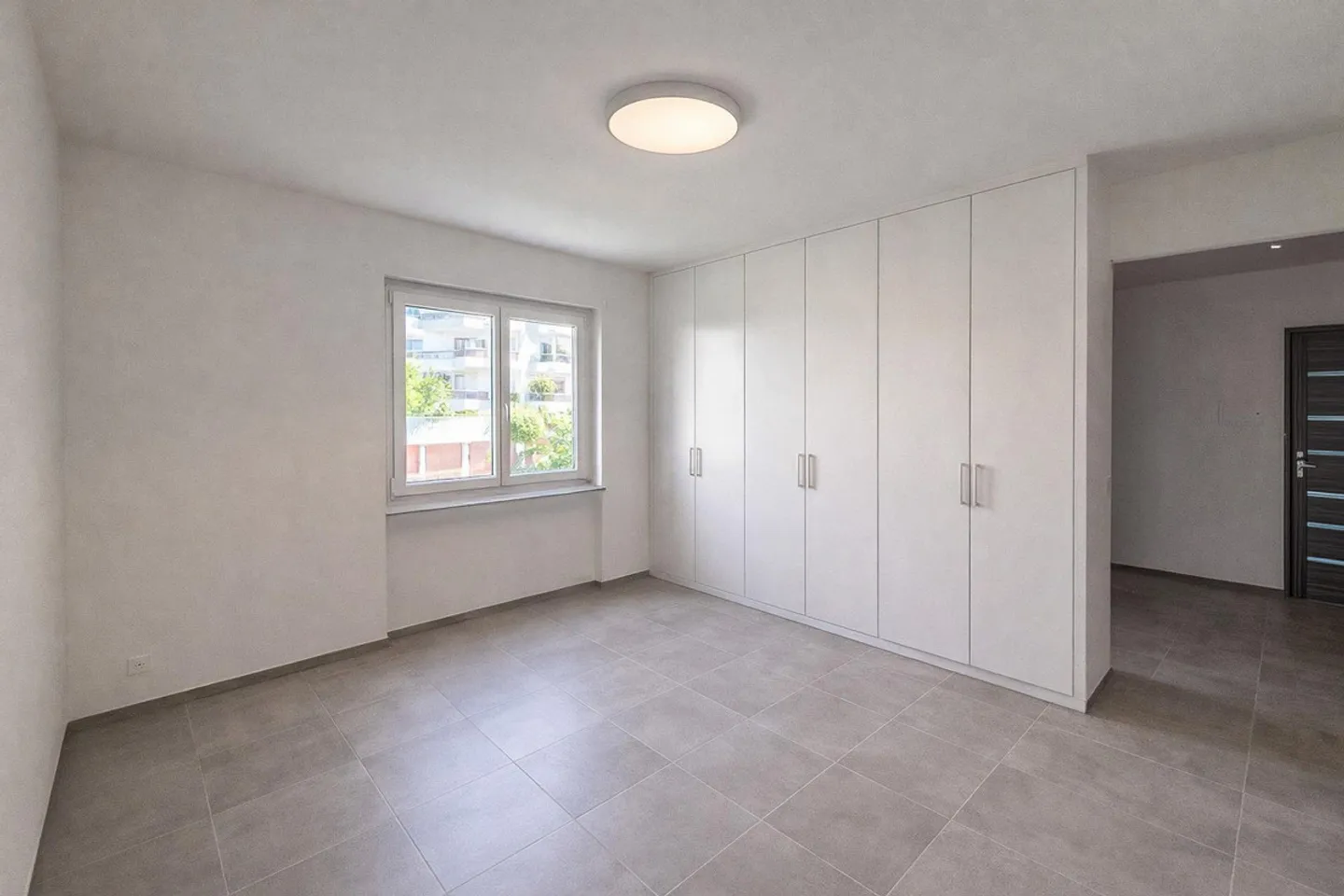 3,5-Zimmer-Wohnung mit teilweisem Seeblick in Melide - Foto 7 von 11