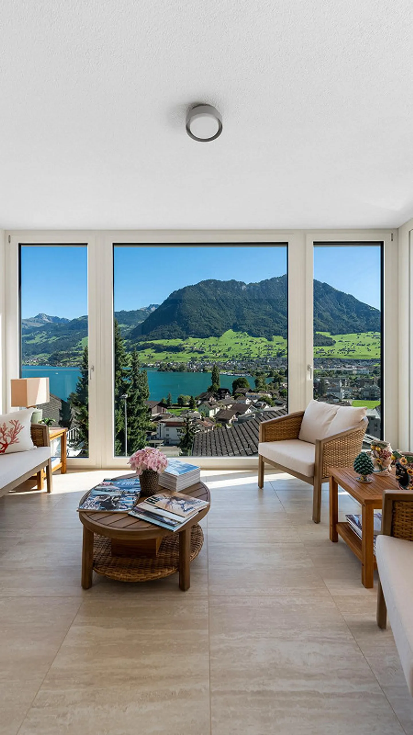 Sunny Living Oasis with Panoramic View over Lake and Mountains - Photo 2 of 6