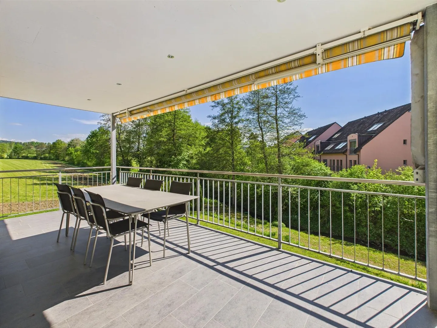 Enjoy the peace and the view of greenery from the large balcony of your new home - Photo 2 of 10