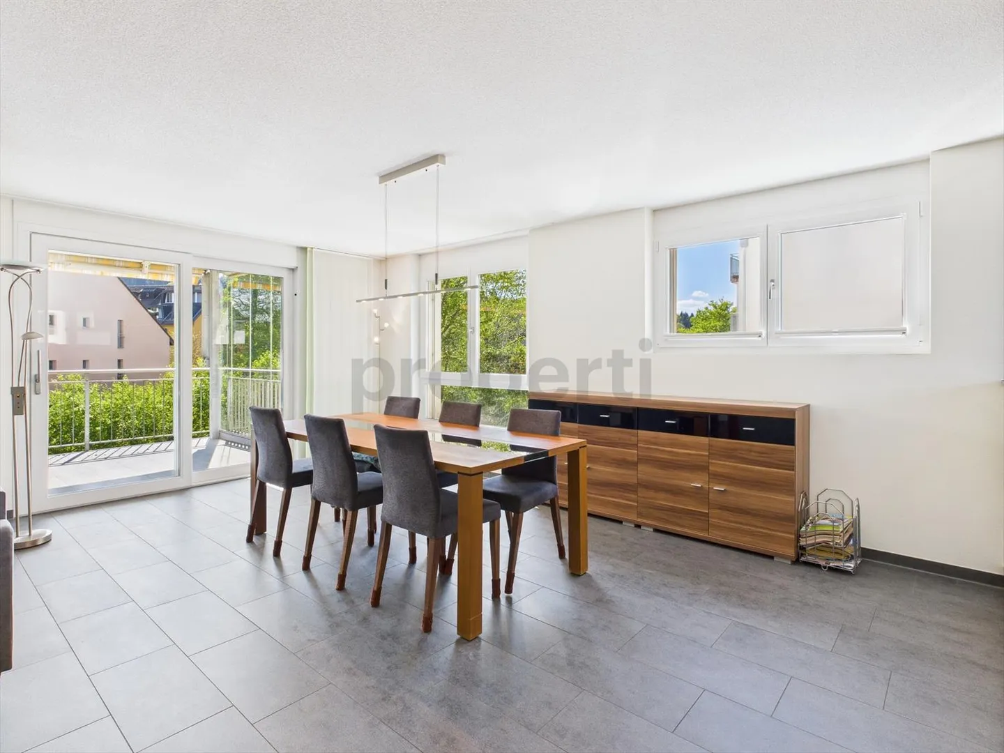Enjoy the peace and the view of greenery from the large balcony of your new home - Photo 5 of 10