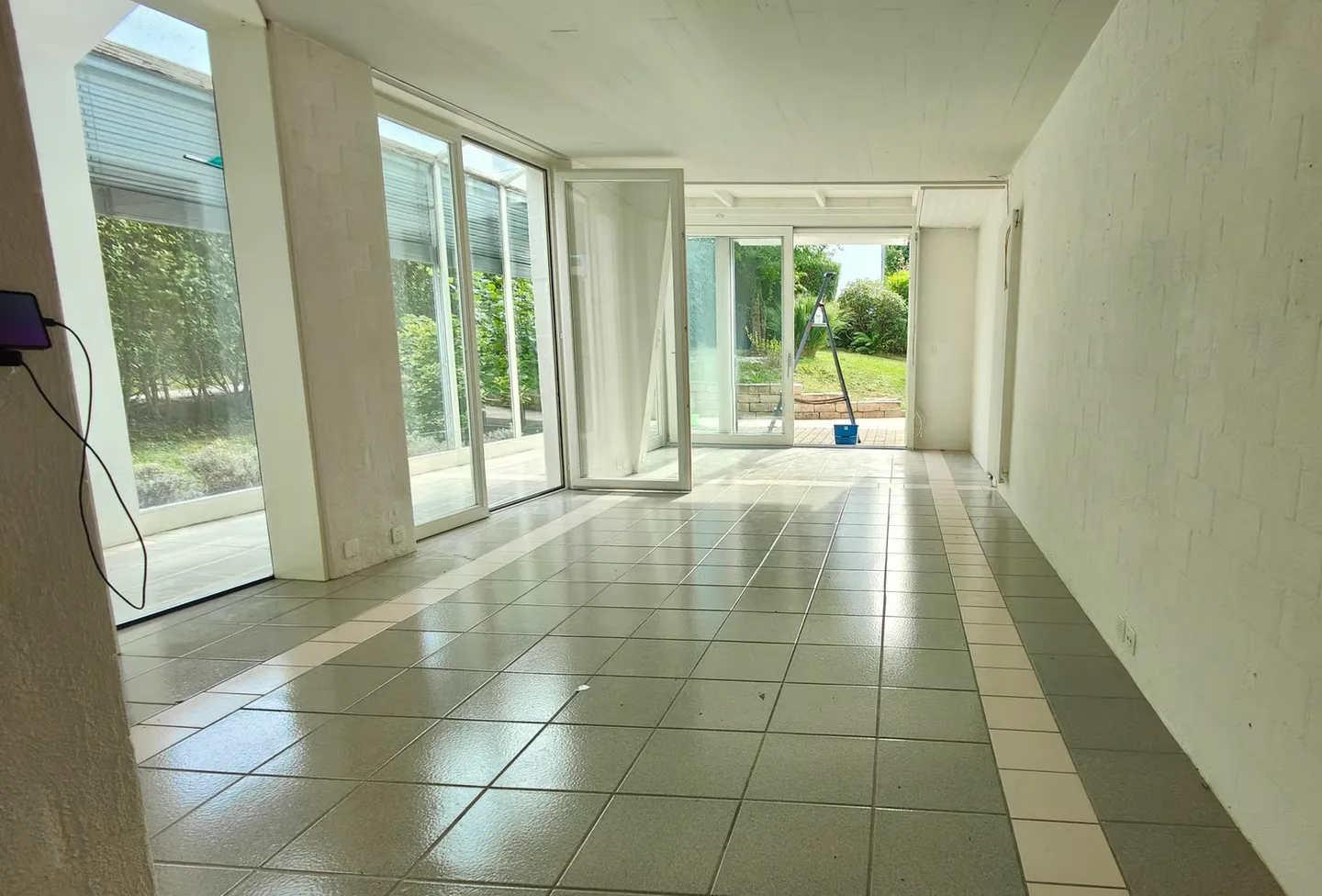 Appartement en duplex lumineux de 4,5 pièces au rez-de-jardin et au 1er étage avec véranda - Photo 5 sur 10