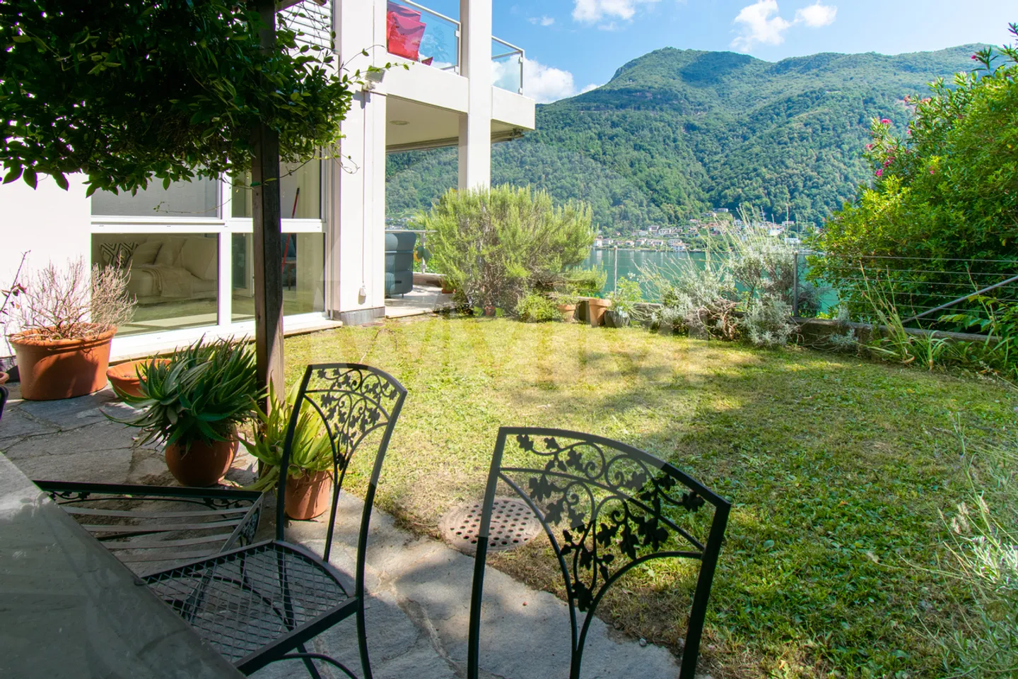 Exklusives Duplex mit spektakulärem Seeblick und Garten - Foto 13 von 19