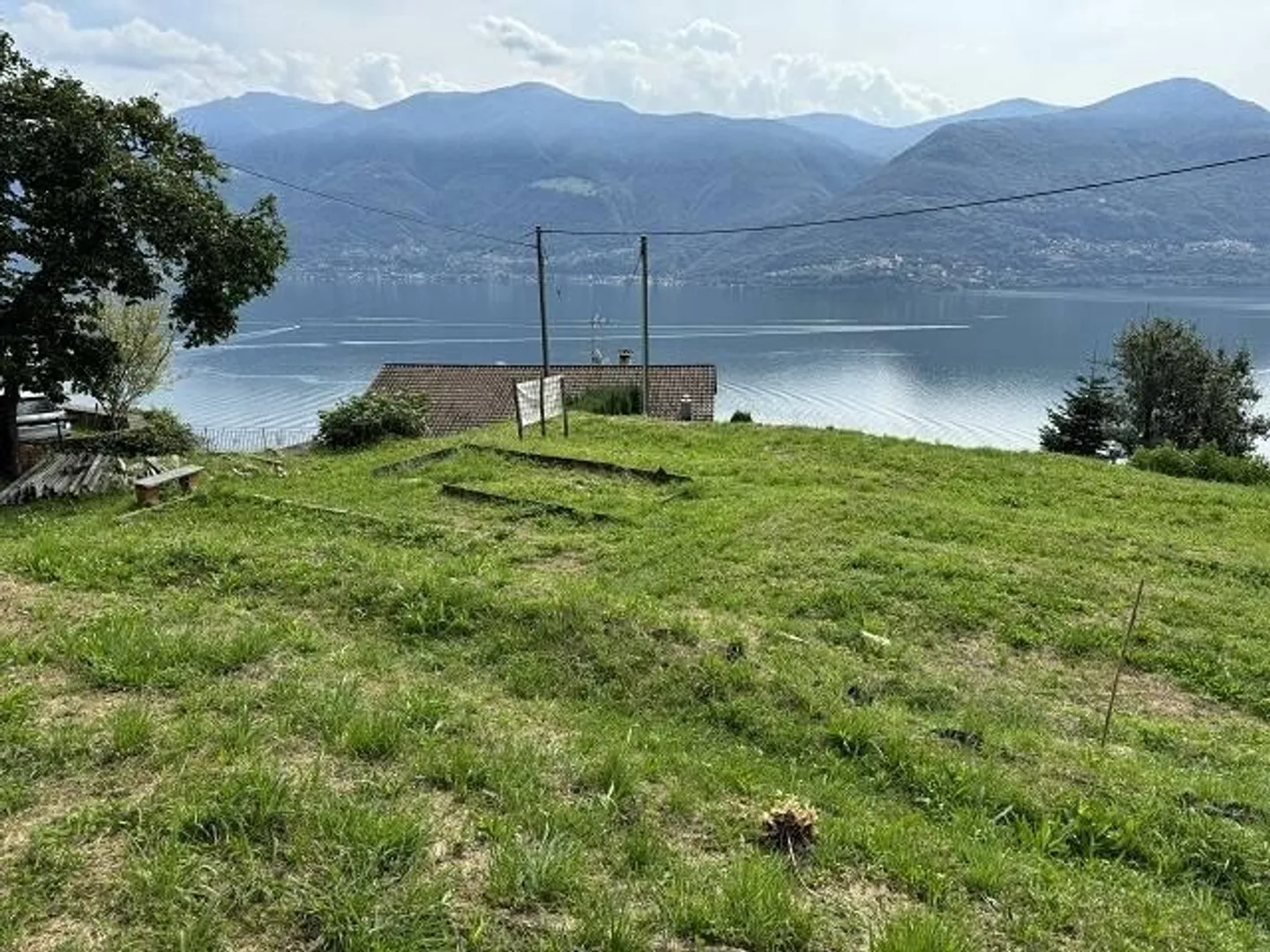 Sonniges Baugrundstück mit Seeblick - Foto 1 von 13