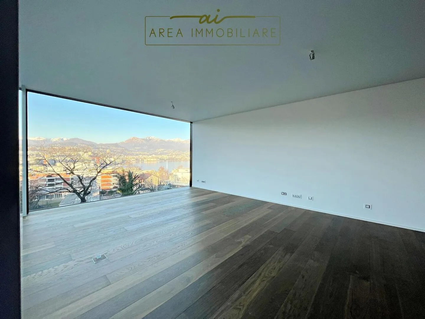 NEW 4.5-ROOM PENTHOUSE WITH LAKE VIEW IN PARADISO - Photo 1 of 13