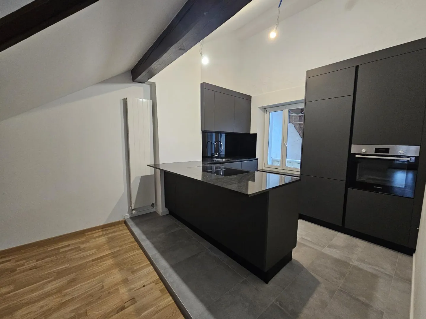 Charming 1.5-room loft apartment with visible beams in Cortaillod - Photo 1 of 10