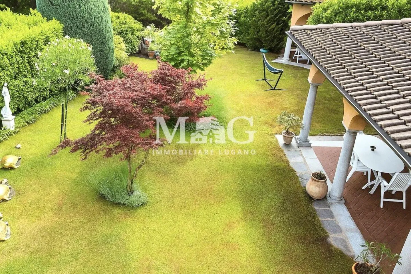 Collina d'Oro: Elegante Villa mit Garten und bebaubarem Land - Foto 8 von 11