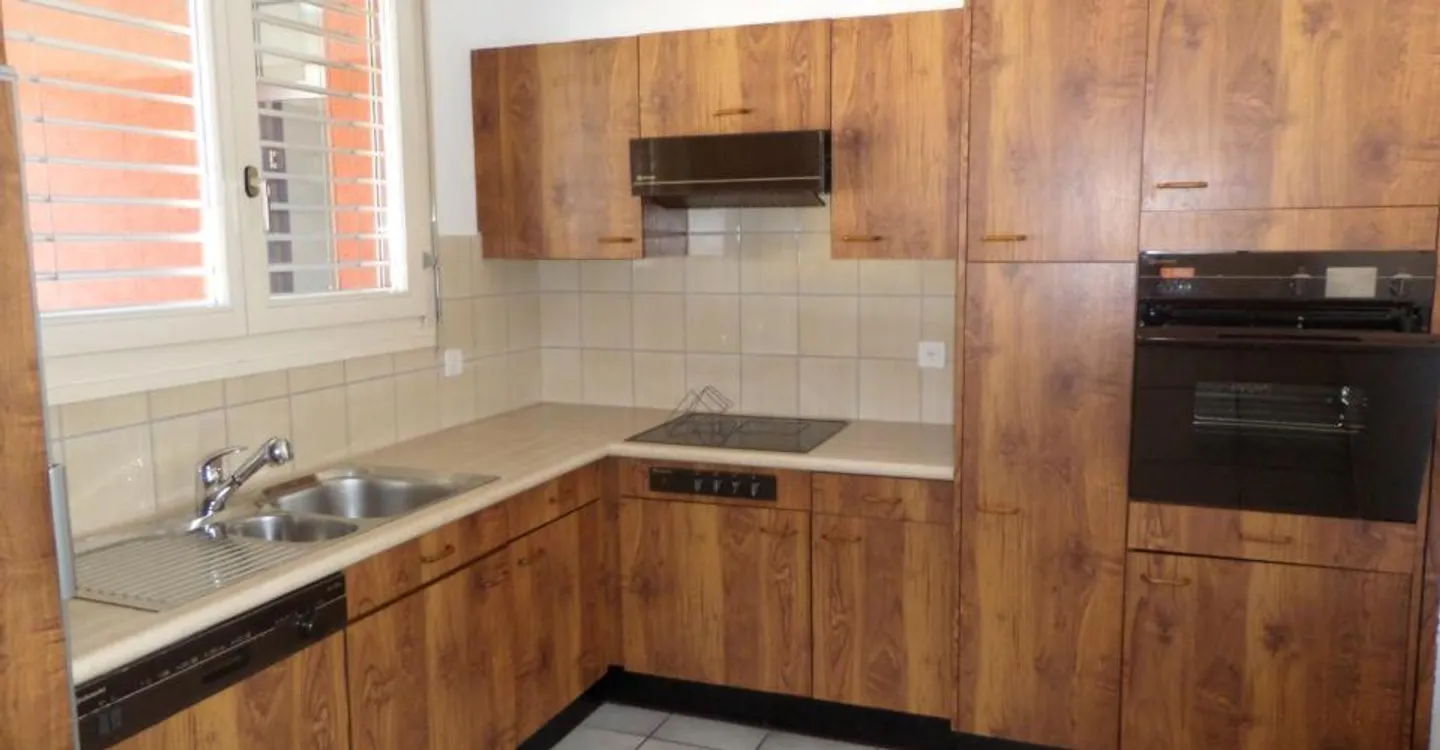Appartement 2,5 pièces dans un quartier vert et calme - Photo 1 sur 5