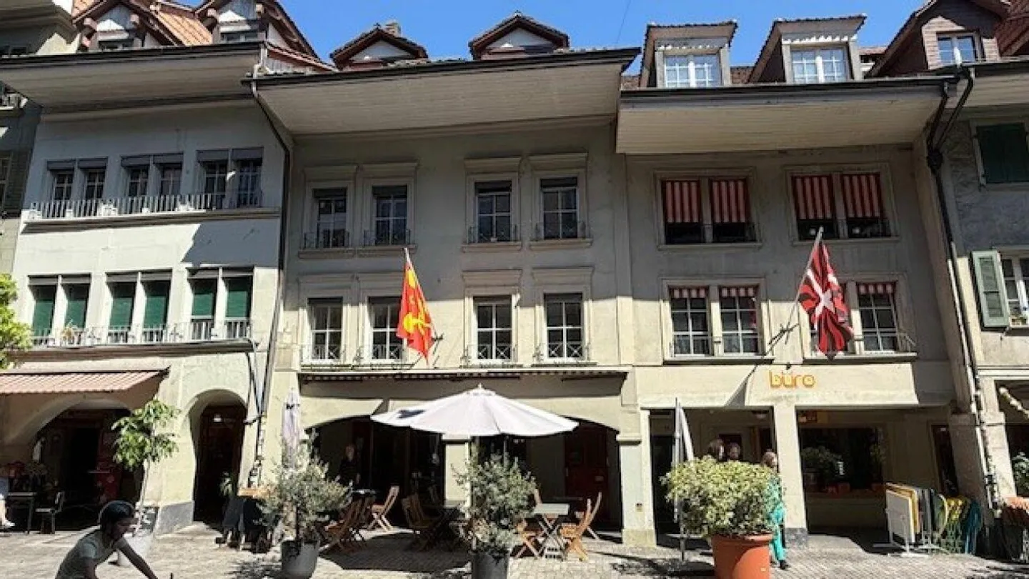 2-room apartment on the 1st floor with a small courtyard seating area - Photo 1 of 8