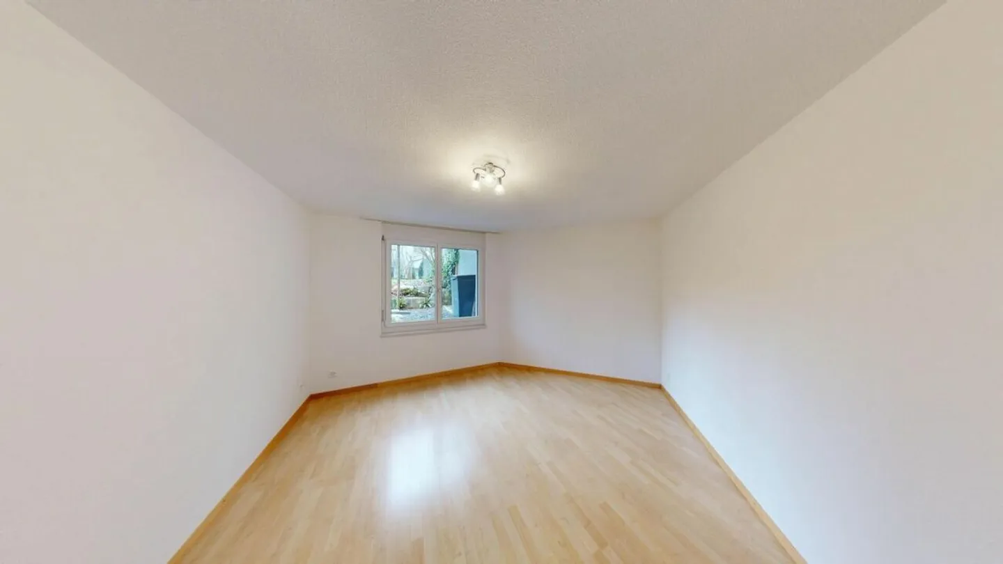 Appartement 3½ pièces confortable avec espace de détente et jardin - Photo 9 sur 19