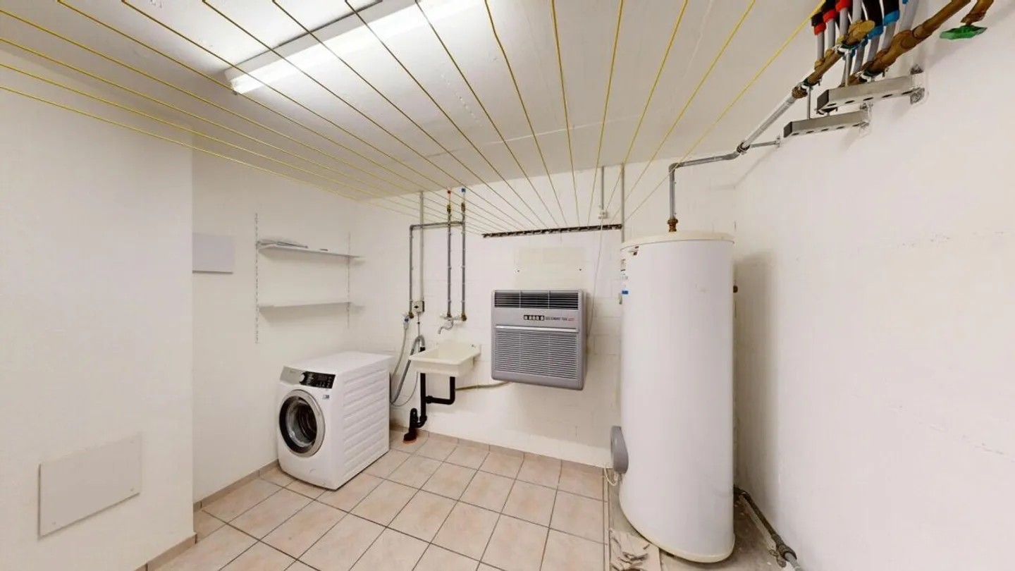 Appartement 3½ pièces confortable avec espace de détente et jardin - Photo 13 sur 19