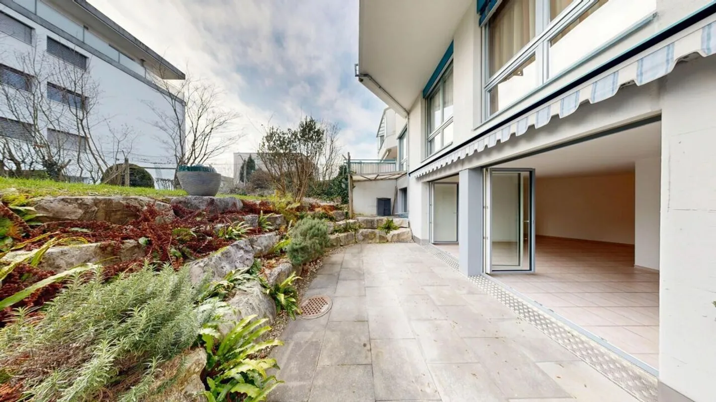 Appartement 3½ pièces confortable avec espace de détente et jardin - Photo 18 sur 19