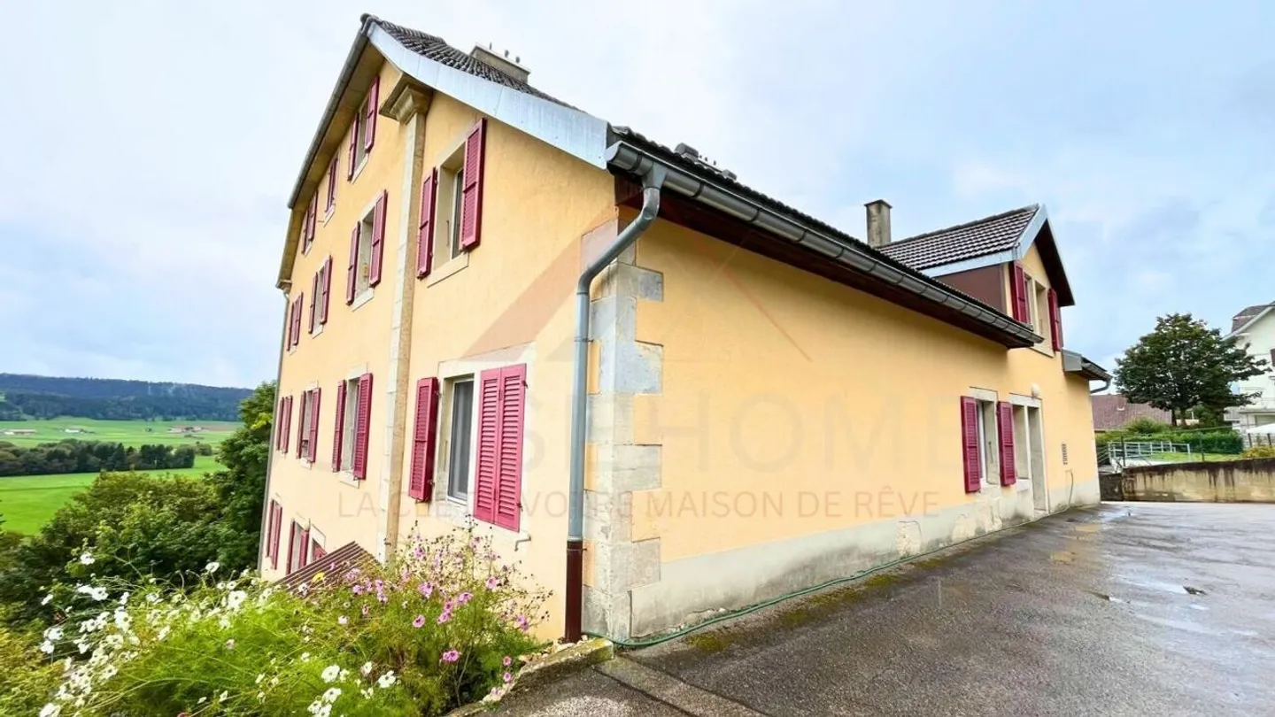 Accueil chaleureux à Échallens : appartement lumineux de 122 m² avec balcon, cheminée et grenier à aménager - Photo 11 sur 11