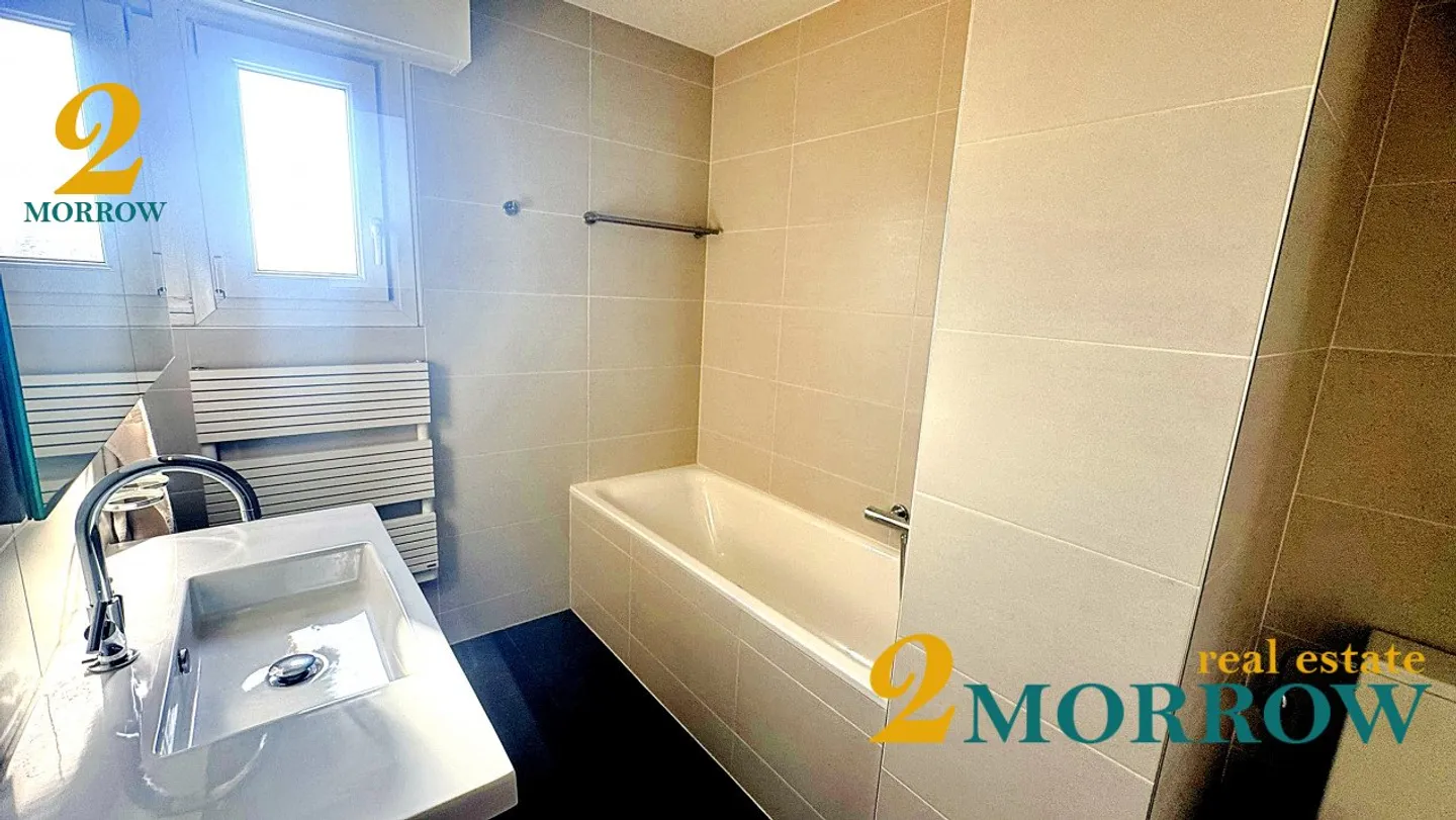 Helles Penthouse mit 4,5 Zimmern und Blick im Herzen von Rolle - Foto 4 von 8