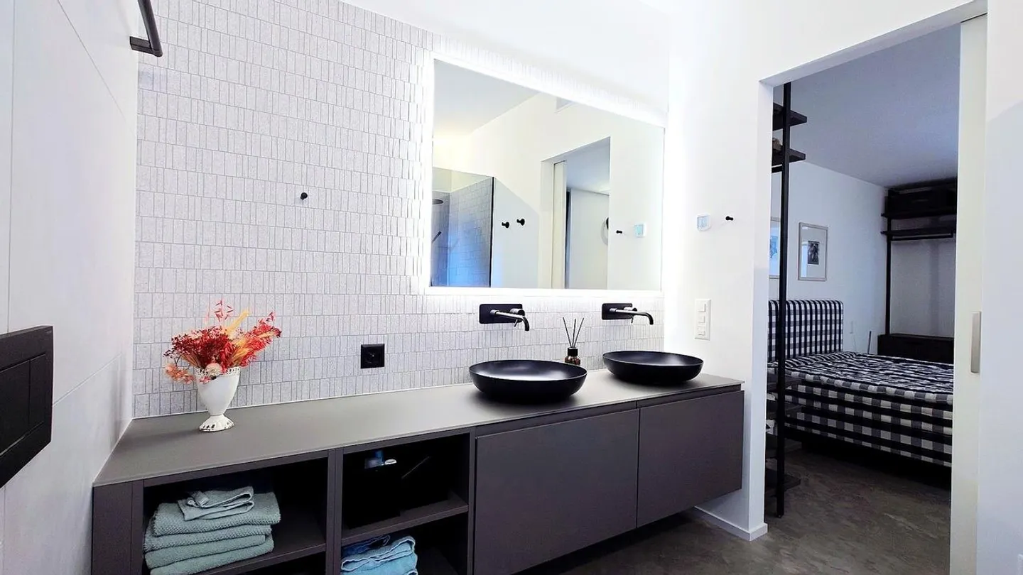 Appartamento 3.5 locali con vista illimitata e architettura senza tempo - Foto 8 di 13