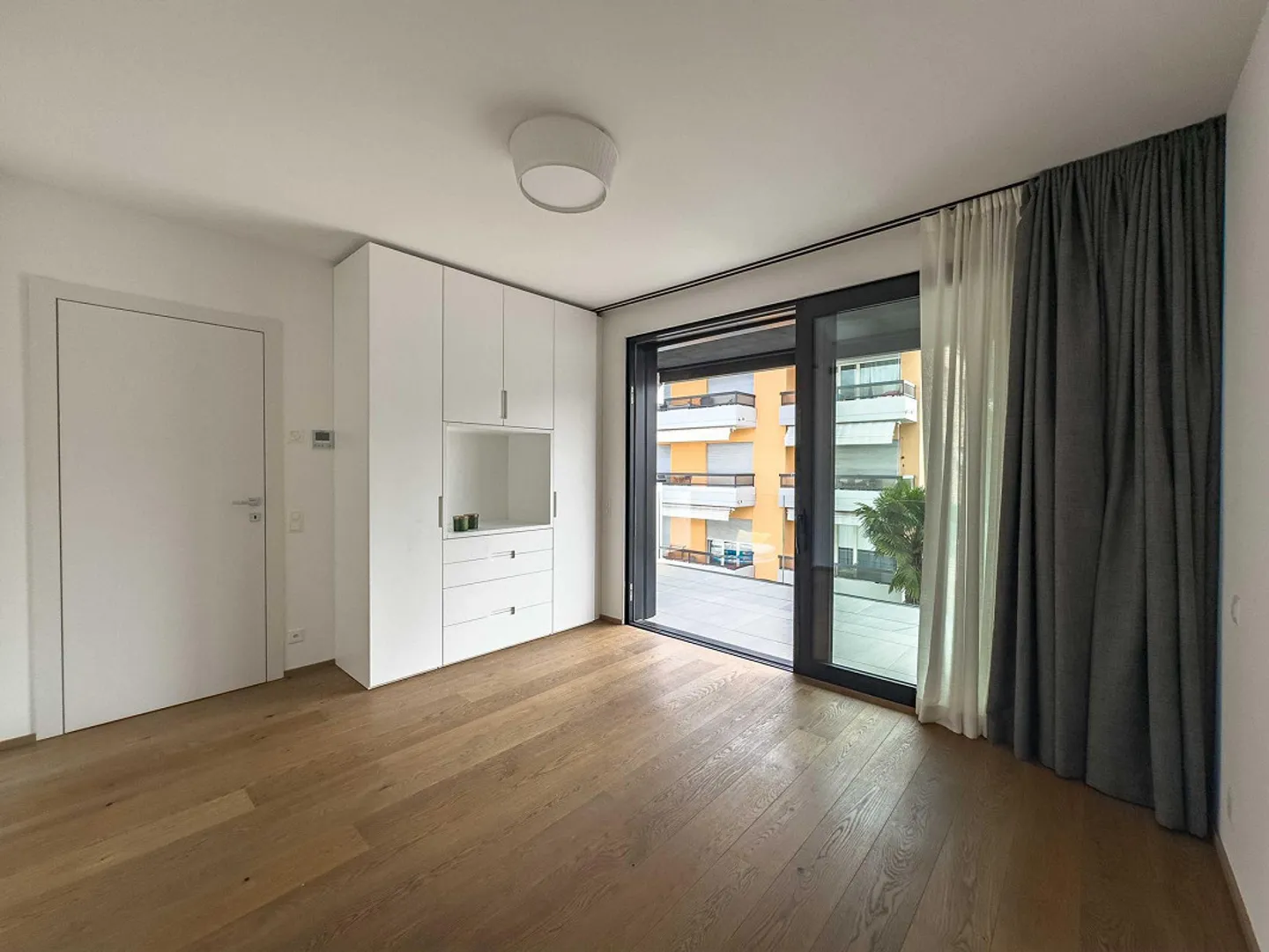 Geräumige Penthouse-Wohnung mit Dachterrasse in Pregassona - Foto 3 von 8