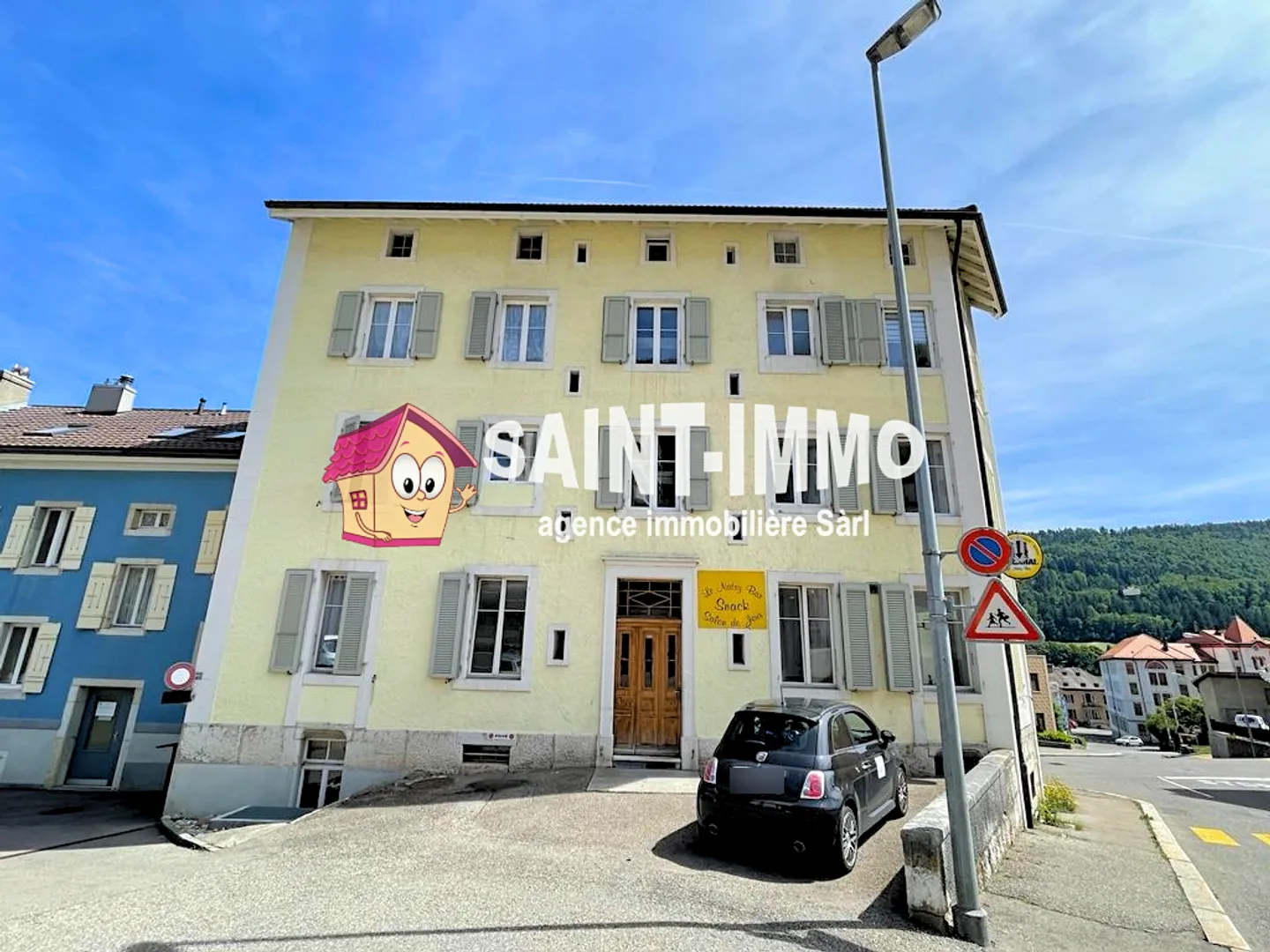Rental building with 6 apartments and bar/restaurant in the center of Saint-Imier - Photo 1 of 7