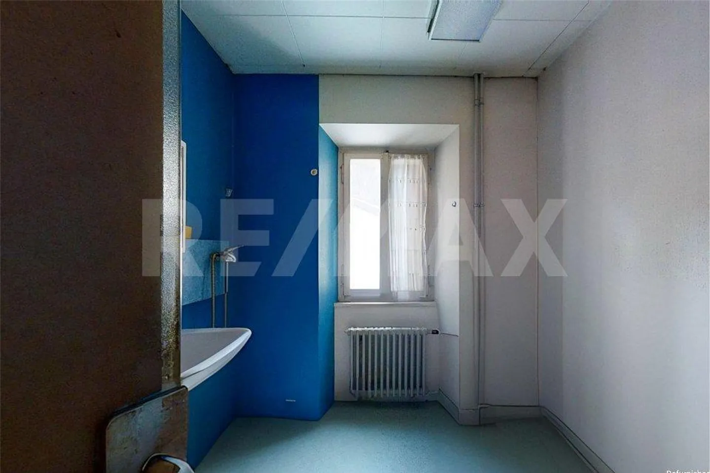 Maison avec 3 appartements et magasin - Photo 6 sur 13