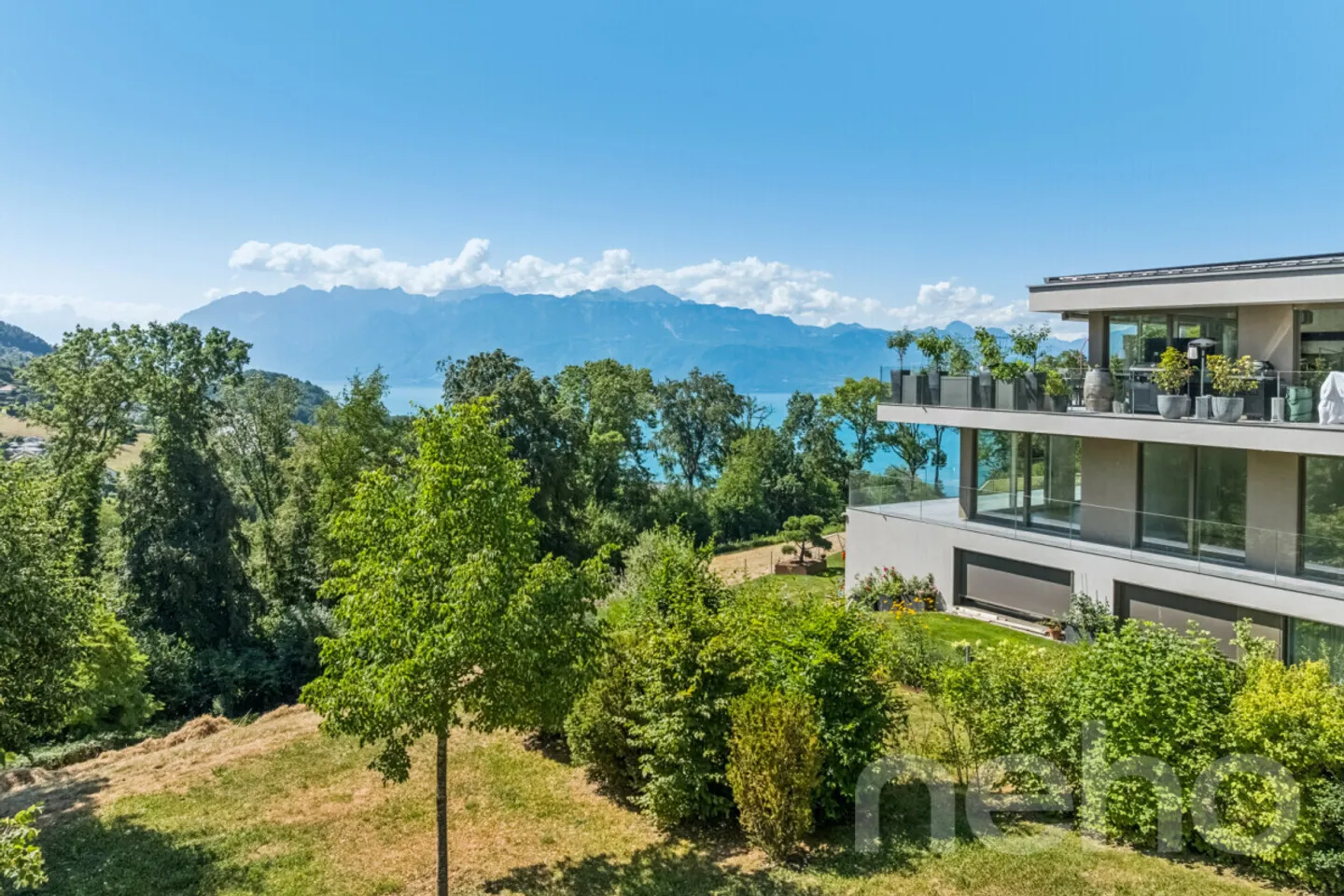 Außergewöhnliche Wohnung mit Panoramablick auf den See und die Alpen - Foto 1 von 12