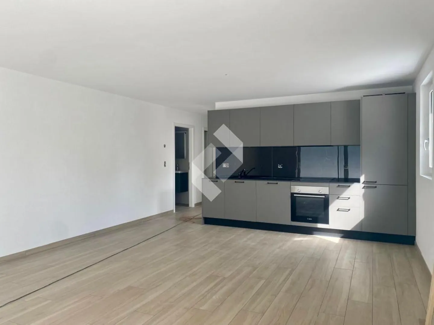 3,5 stanze NUOVE con giardino privato! - Foto 1 di 12