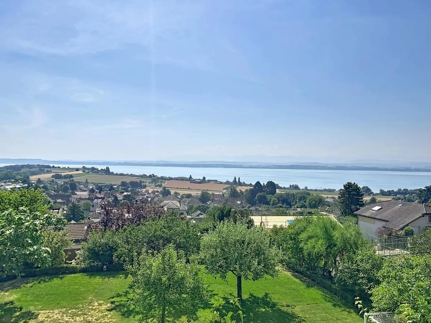 A Green Jewel with Panoramic Views of the Lake and the Alps - Photo 1 of 13