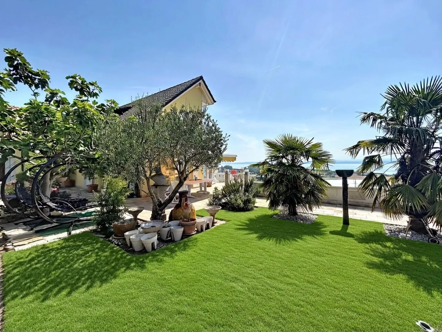 A Green Jewel with Panoramic Views of the Lake and the Alps - Photo 2 of 13