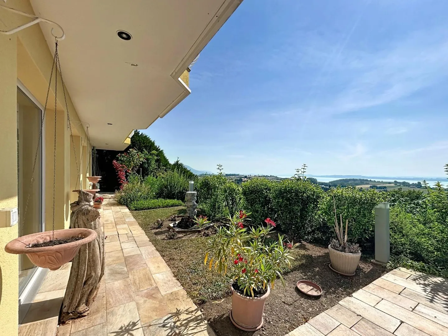 A Green Jewel with Panoramic Views of the Lake and the Alps - Photo 5 of 13