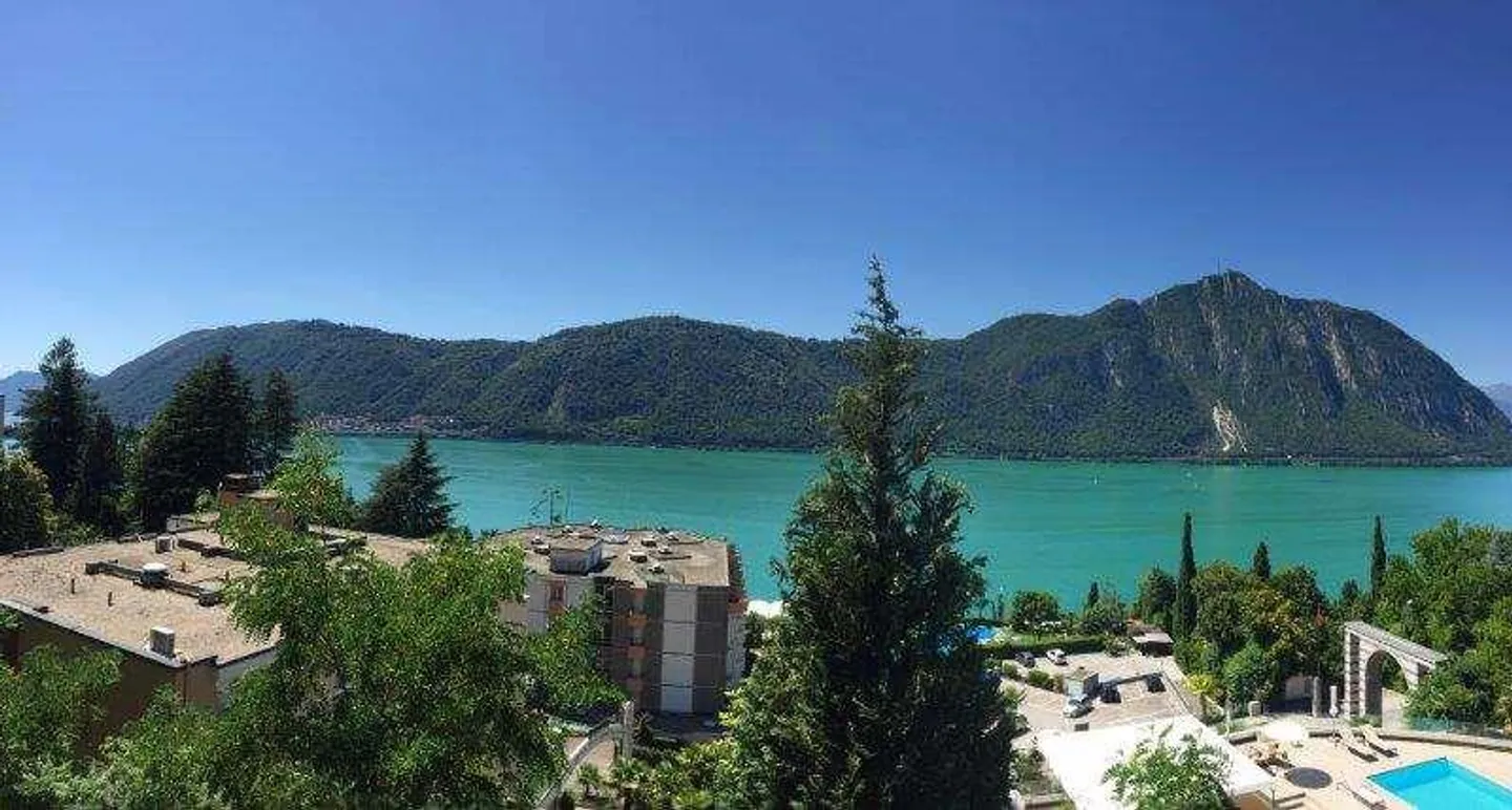 BISSONE : APPARTEMENT PRESTIGIEUX 4.5 PIÈCES AVEC VUE SUR LE LAC ET JARDIN - Photo 2 sur 13