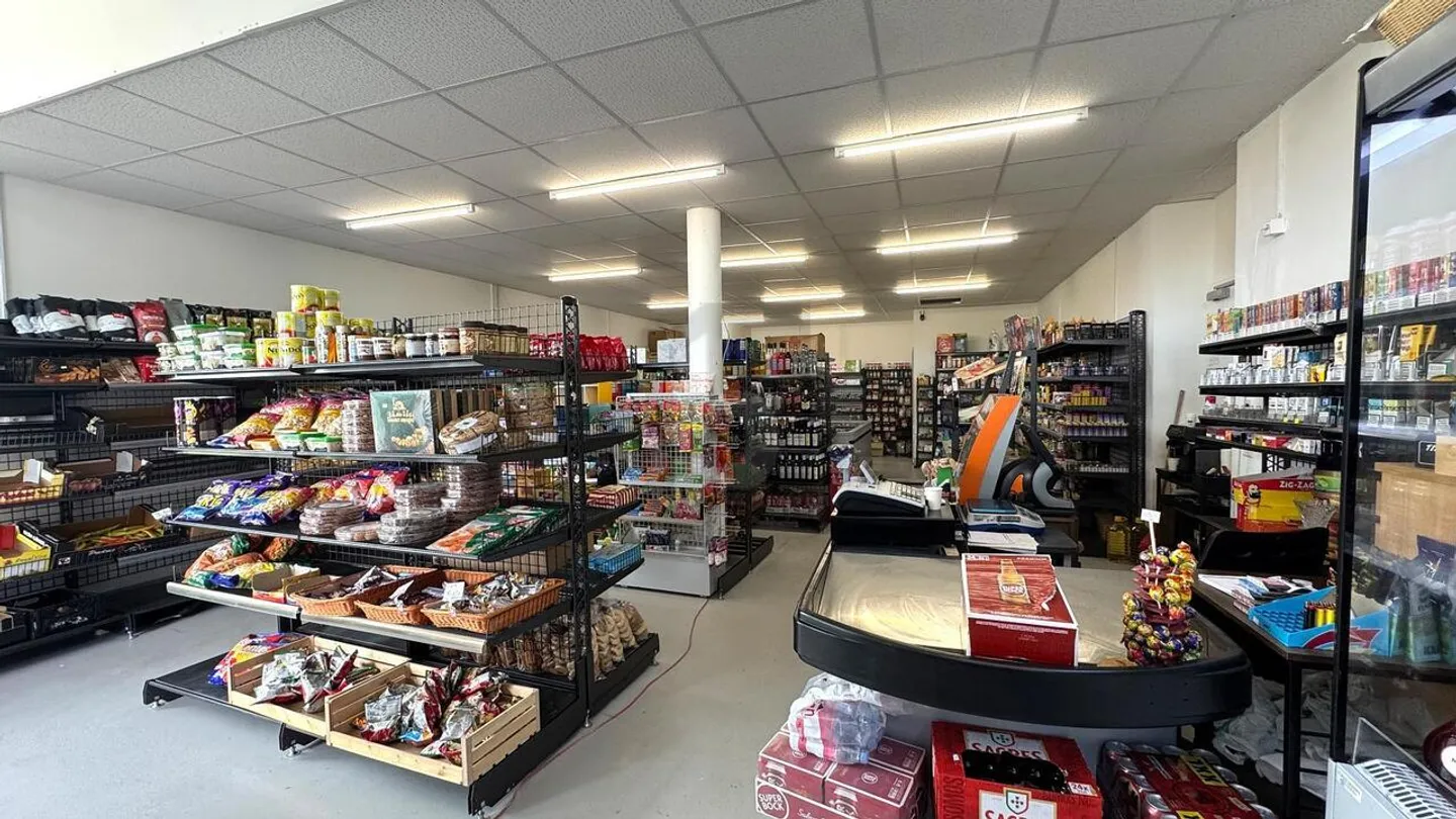 STORE IN A NEW NEIGHBORHOOD - Photo 1 of 5