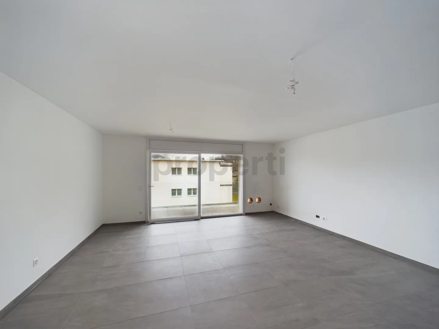 Modernes 3,5-Zimmer-Apartment in Caslano - Foto 1 von 11