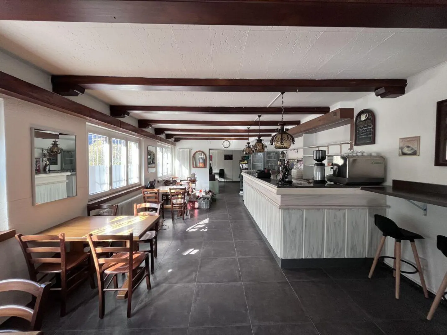 Income-generating building with restaurant, apartments, and parking area with... - Photo 1 of 12