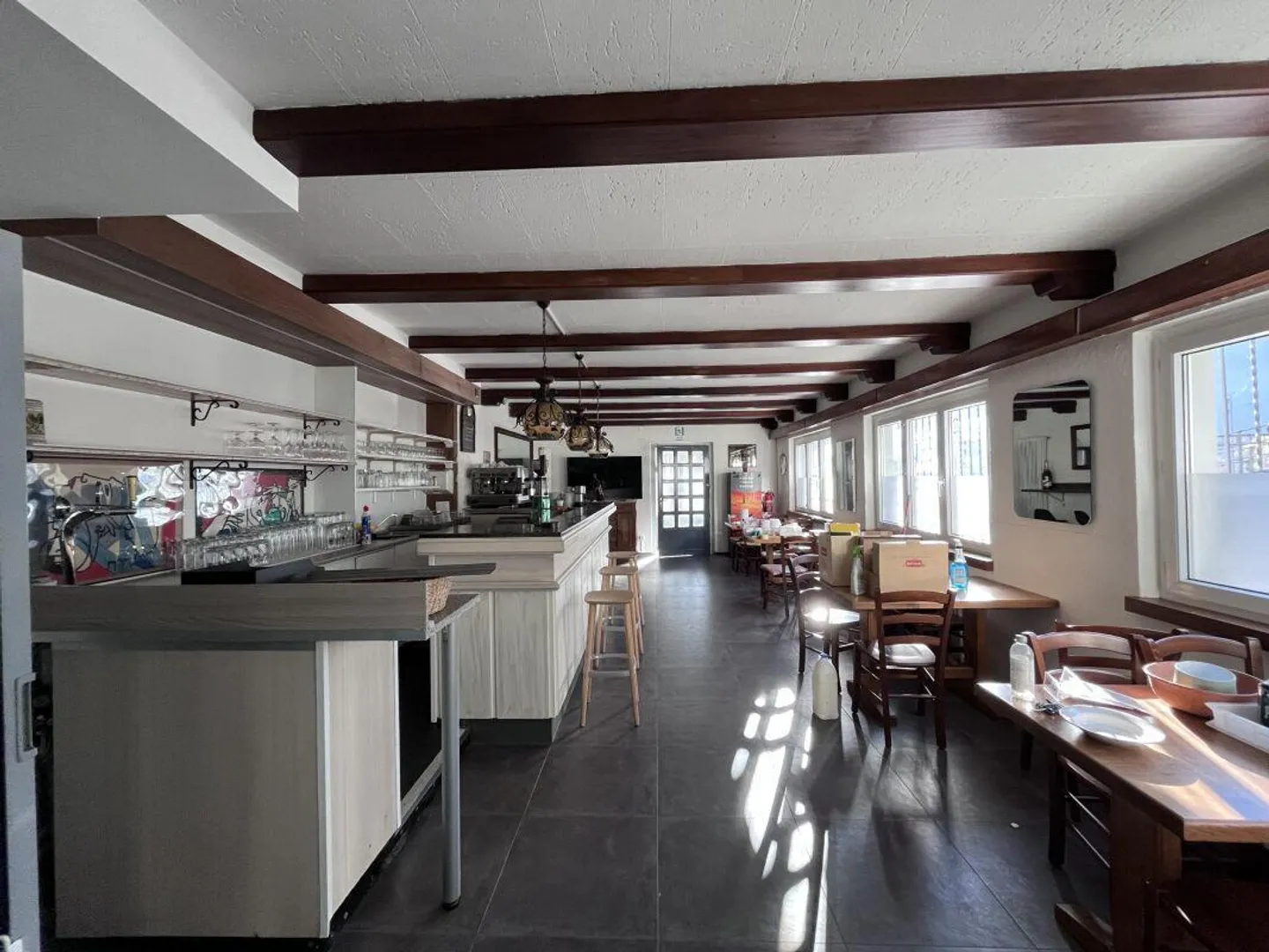 Income-generating building with restaurant, apartments, and parking area with... - Photo 2 of 12