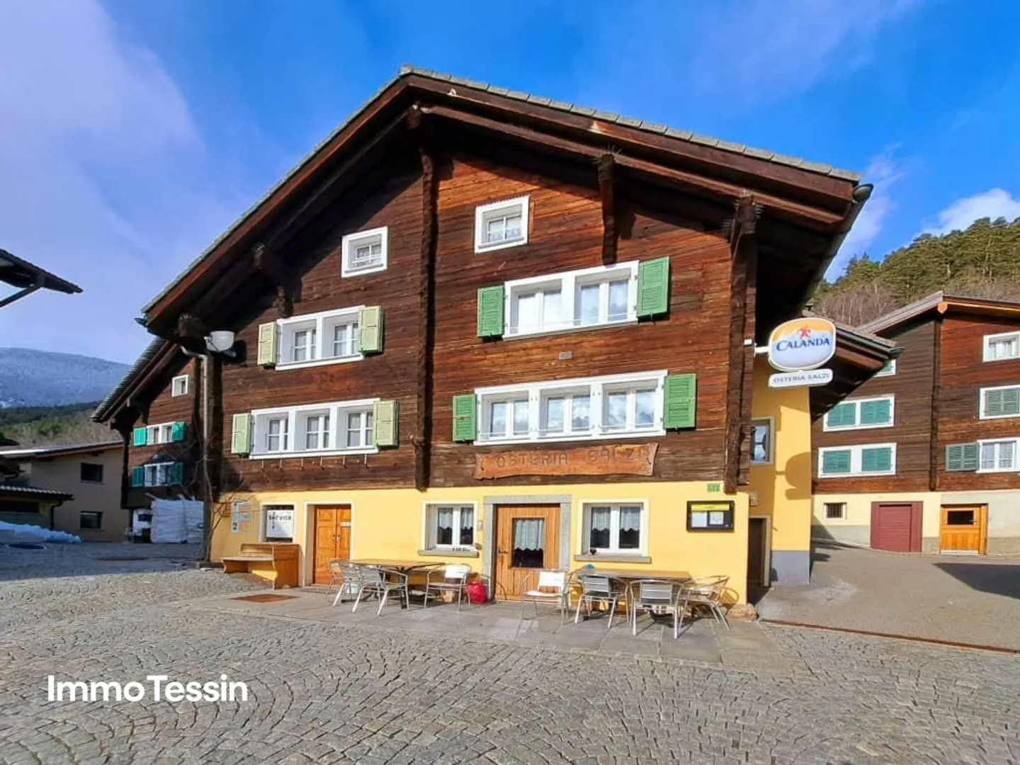 Small Charming Inn at the Famous Village Square of Osco with Great Potential - Photo 2 of 13