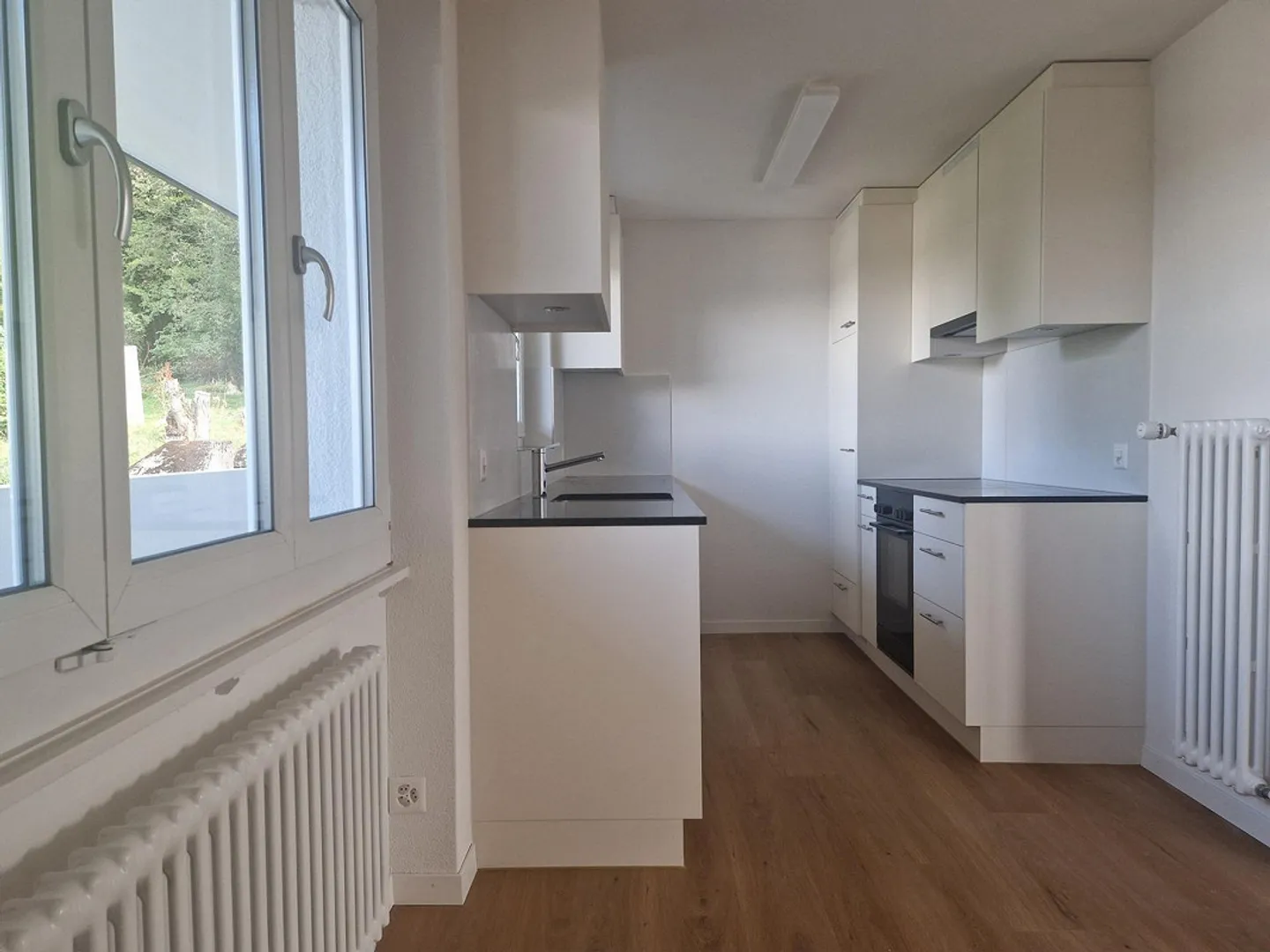 Appartement entièrement rénové dans un emplacement calme et central - Photo 5 sur 6