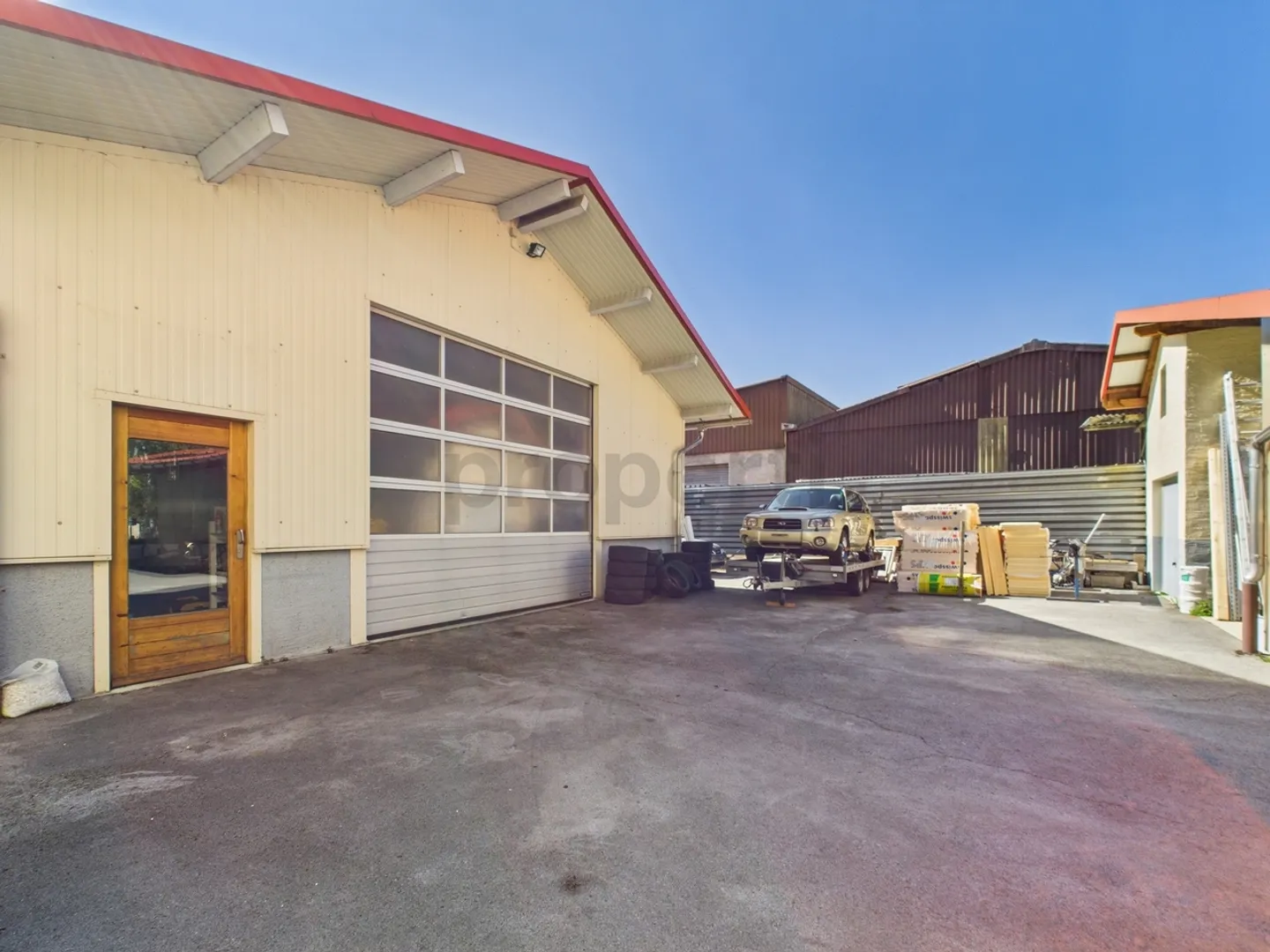 Rental building with 2 apartments, workshop and large plot in Noiraigue - Photo 6 of 10