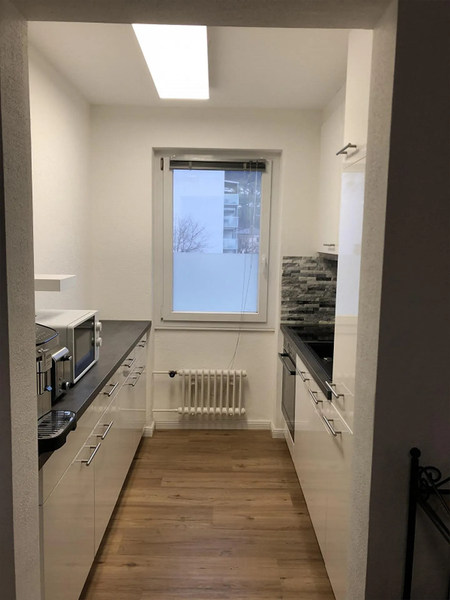 Appartement 2,5 pièces - Photo 3 sur 7