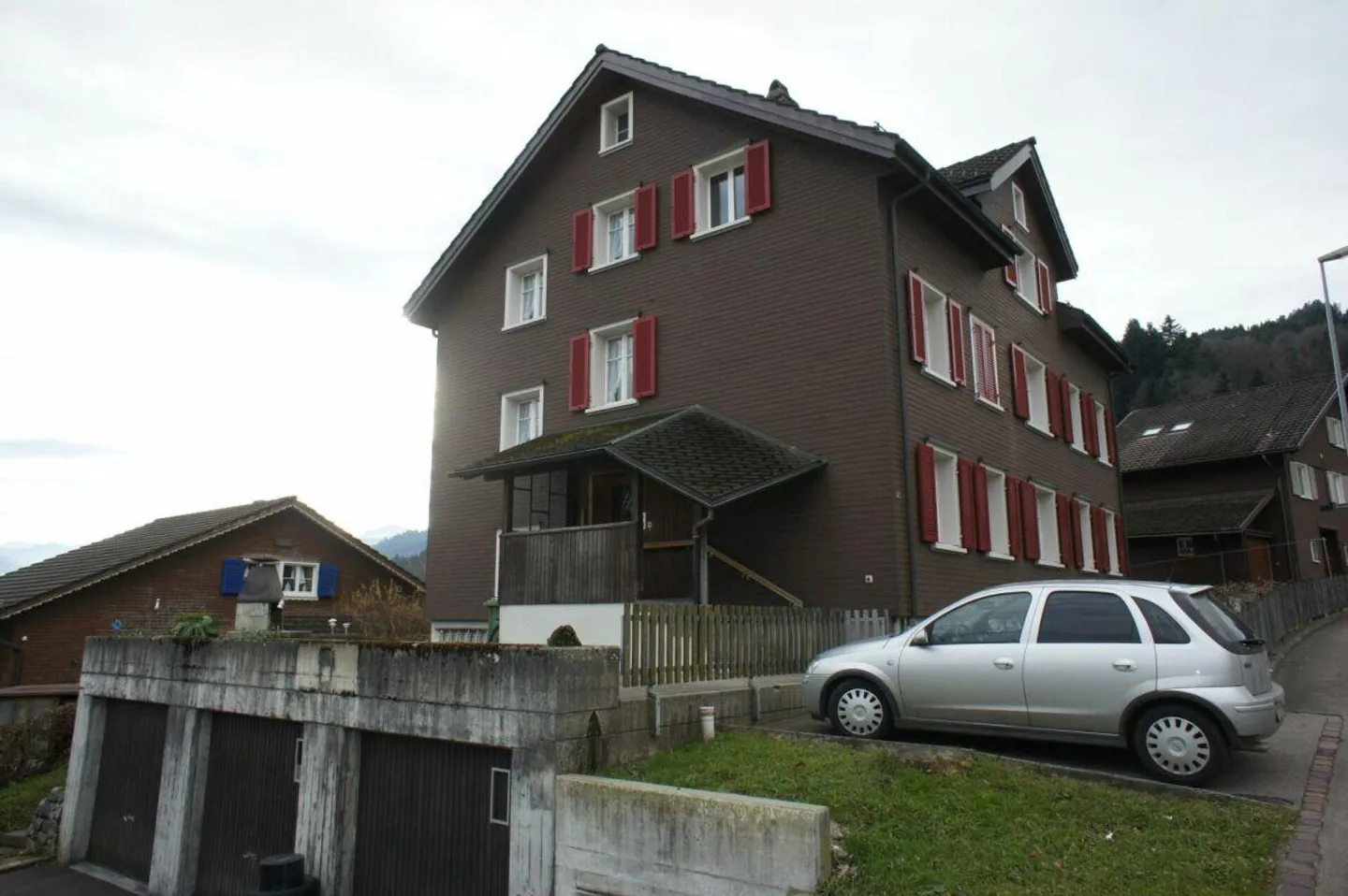Well-maintained 3-family house with 3 single garages - Photo 2 of 13