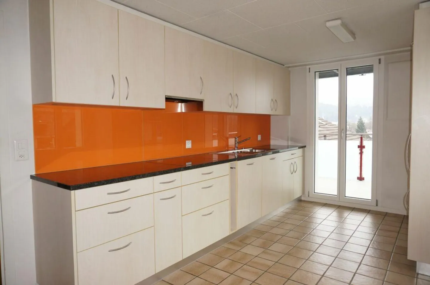 Well-maintained 3-family house with 3 single garages - Photo 4 of 13