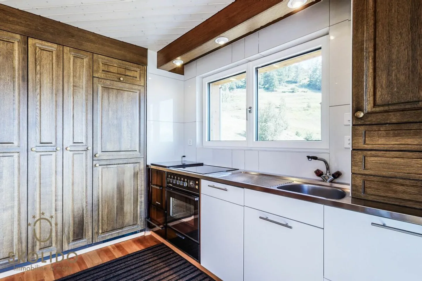 Modernisiertes Chalet mit Einliegerwohnung und Weitblick - Foto 12 von 36