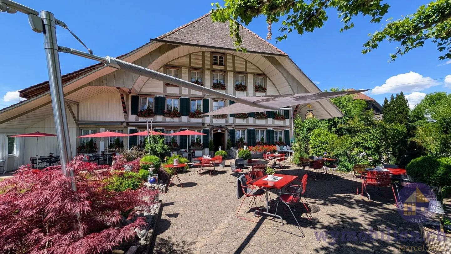 Triple Attractive: Minergie Apartments, Profitable Inn + Building Land! - Photo 1 of 8