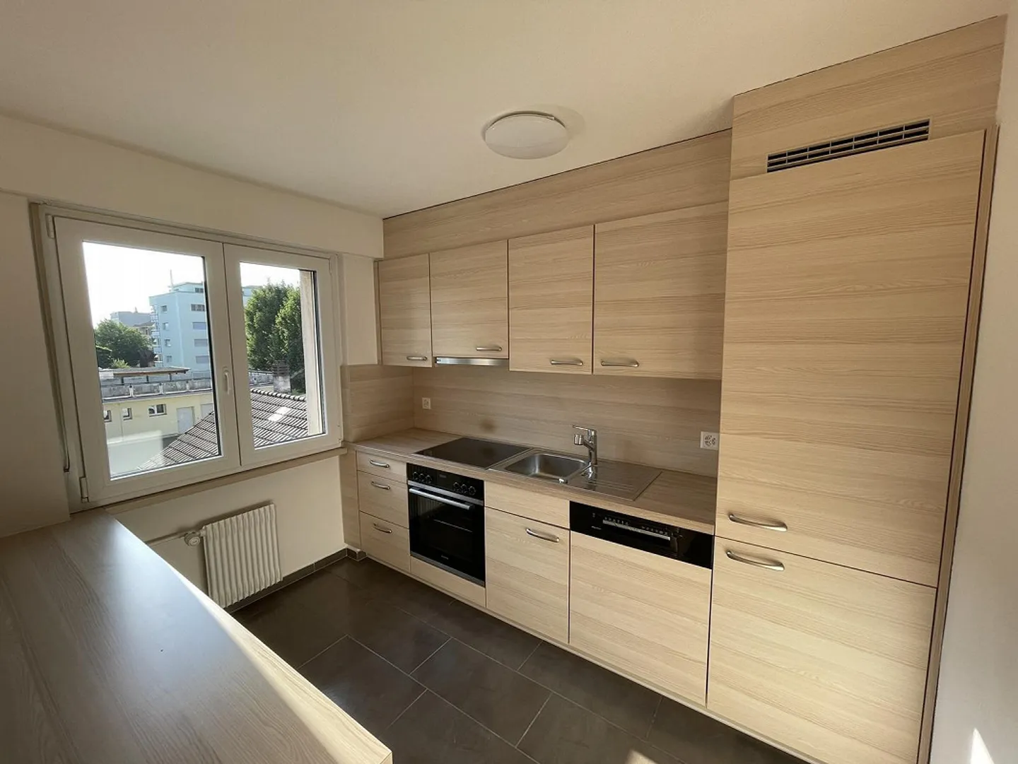 Affordable Living in the Center of Niederuzwil - Photo 1 of 12