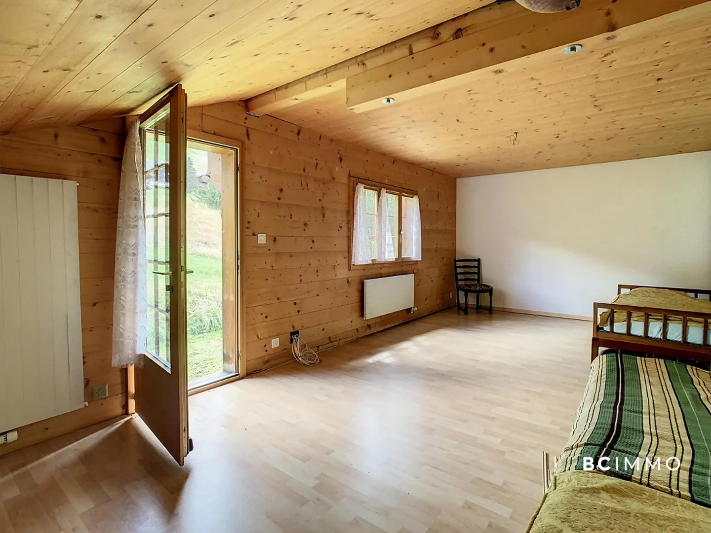 Chalet mit zwei Wohnungen und einem Geschäft | BC IMMO - Foto 8 von 9